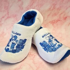 Dutch-themed slippers with blue embroidery on pink background.