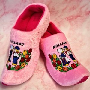 Pink Holland slippers with embroidered tulips and figures.