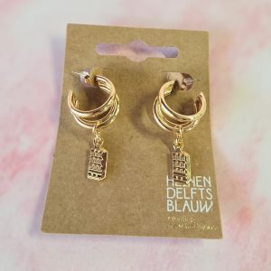Gold hoop earrings with building charm design.