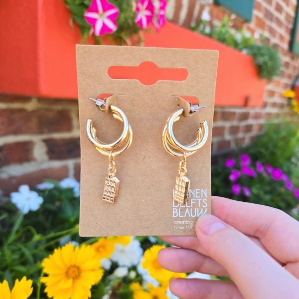 Gold hoop earrings with phone charms outdoors