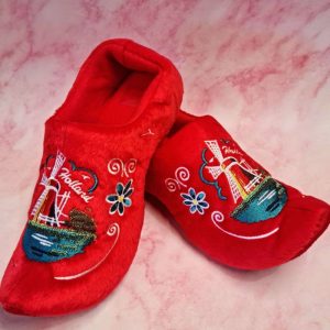 Red slippers with embroidered Holland windmill design.